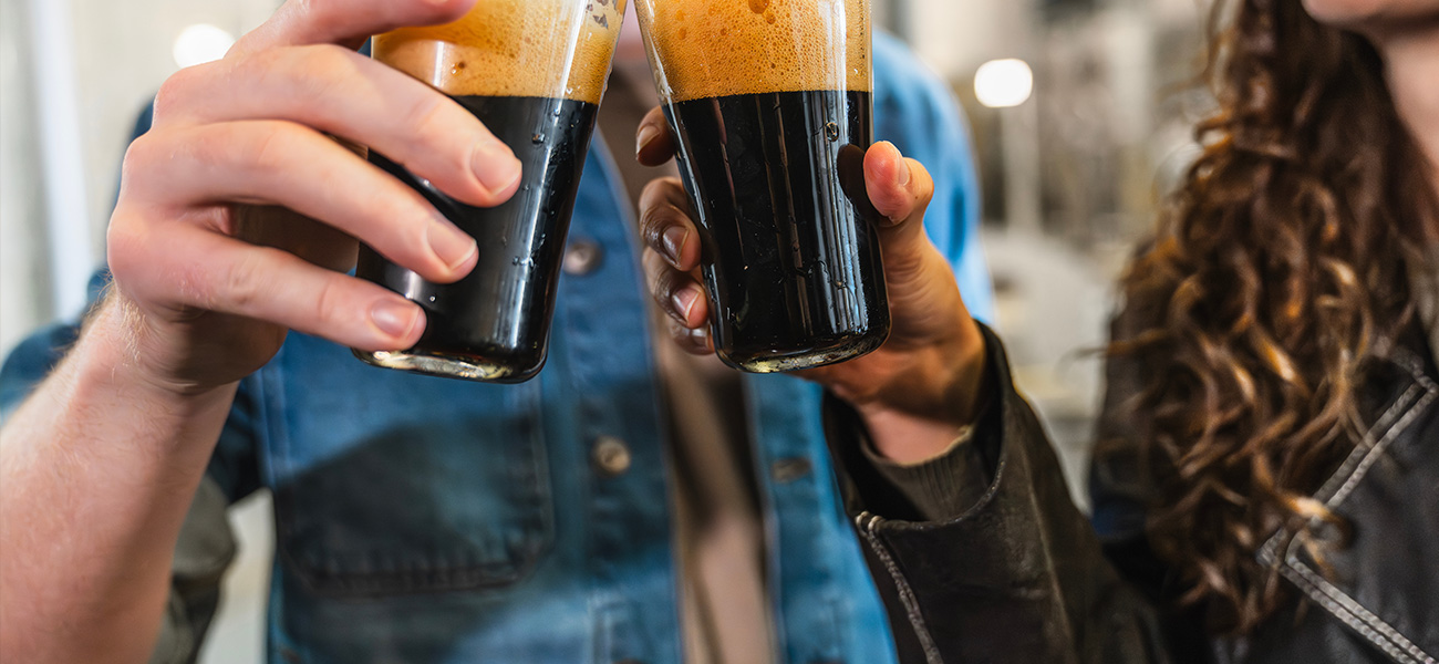 Young couple enjoys beer at a craft brewery.