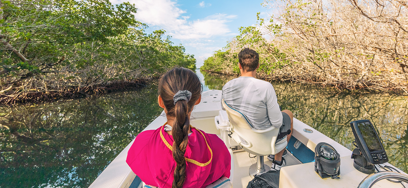 Dad and daughter on an airboat tour in the Everglades.