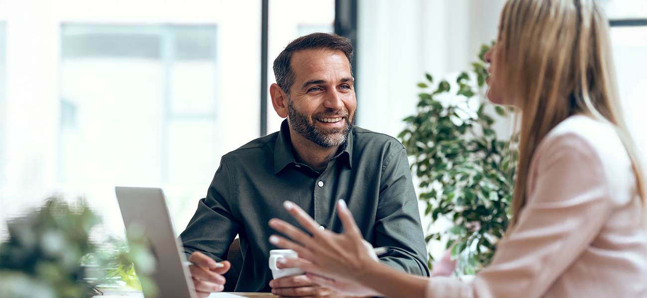 Man and woman collaborating at a coworking space.
