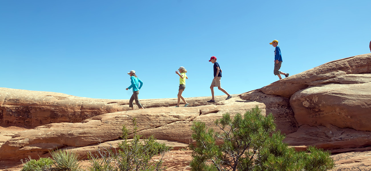 Family hiking in the Red Rocks Park.