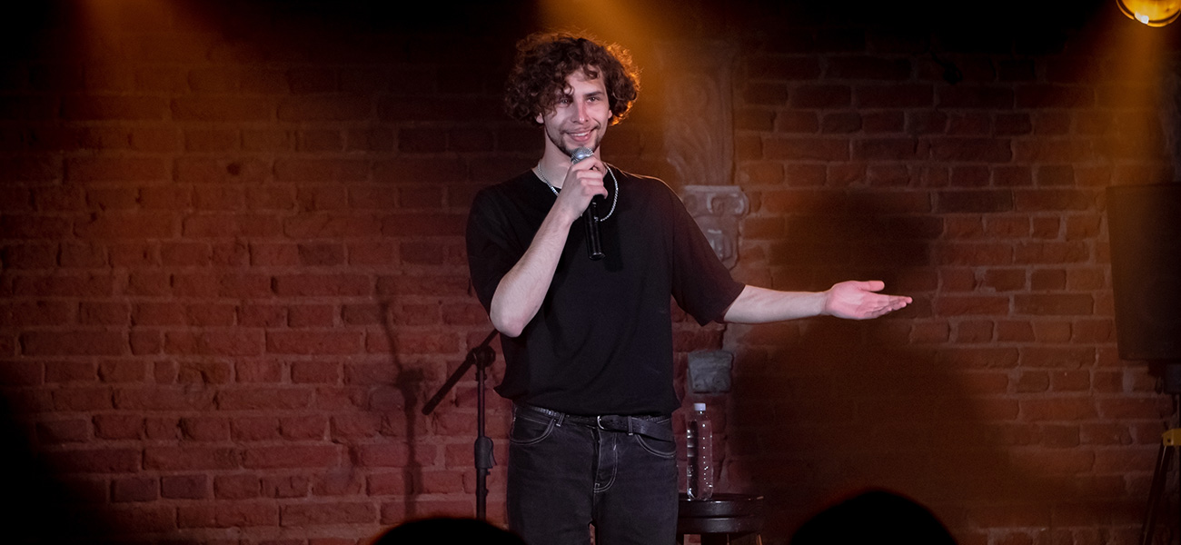 Comedian performing at a comedy club.