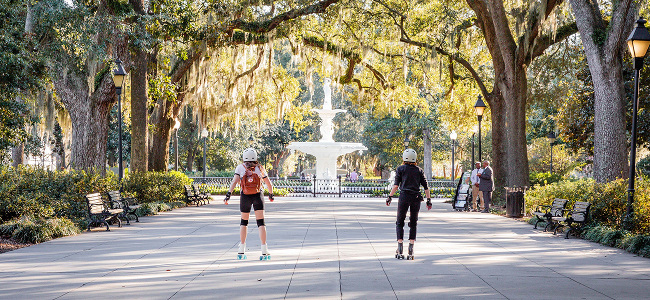 Friends roller skating in Forsyth Park.