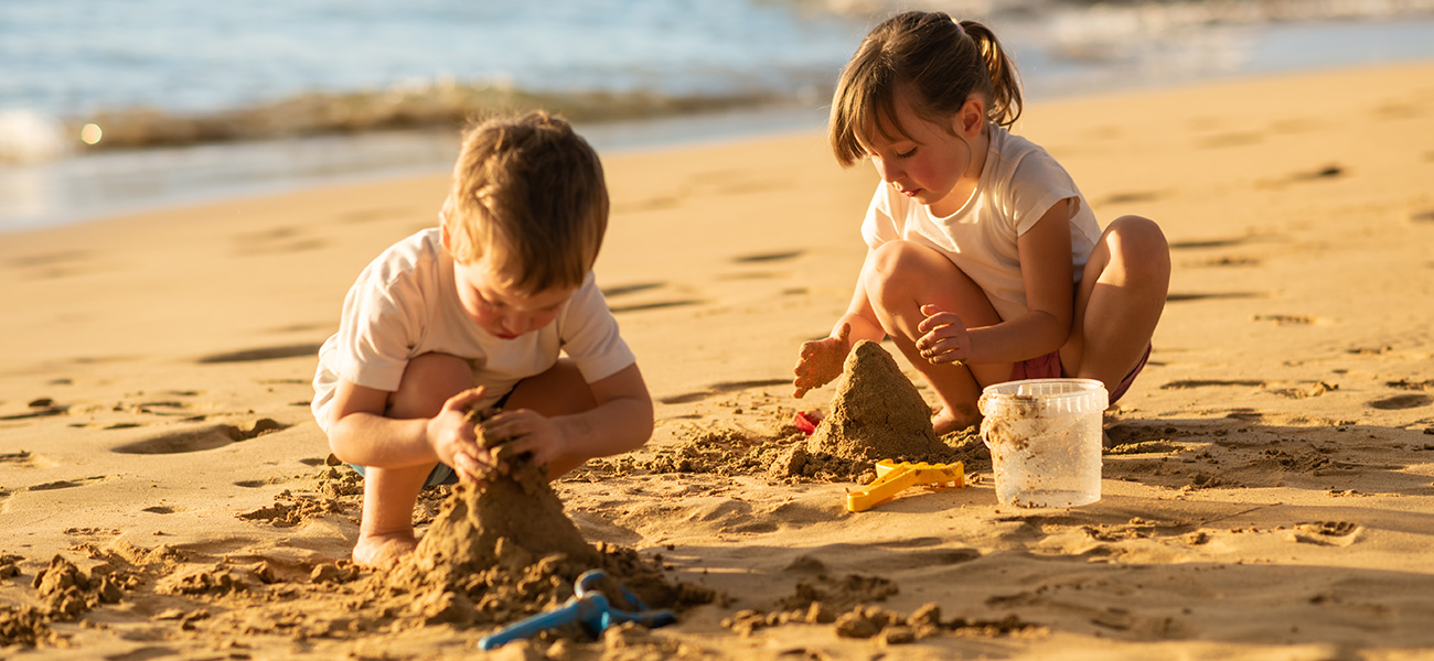Kids building sandcastles.