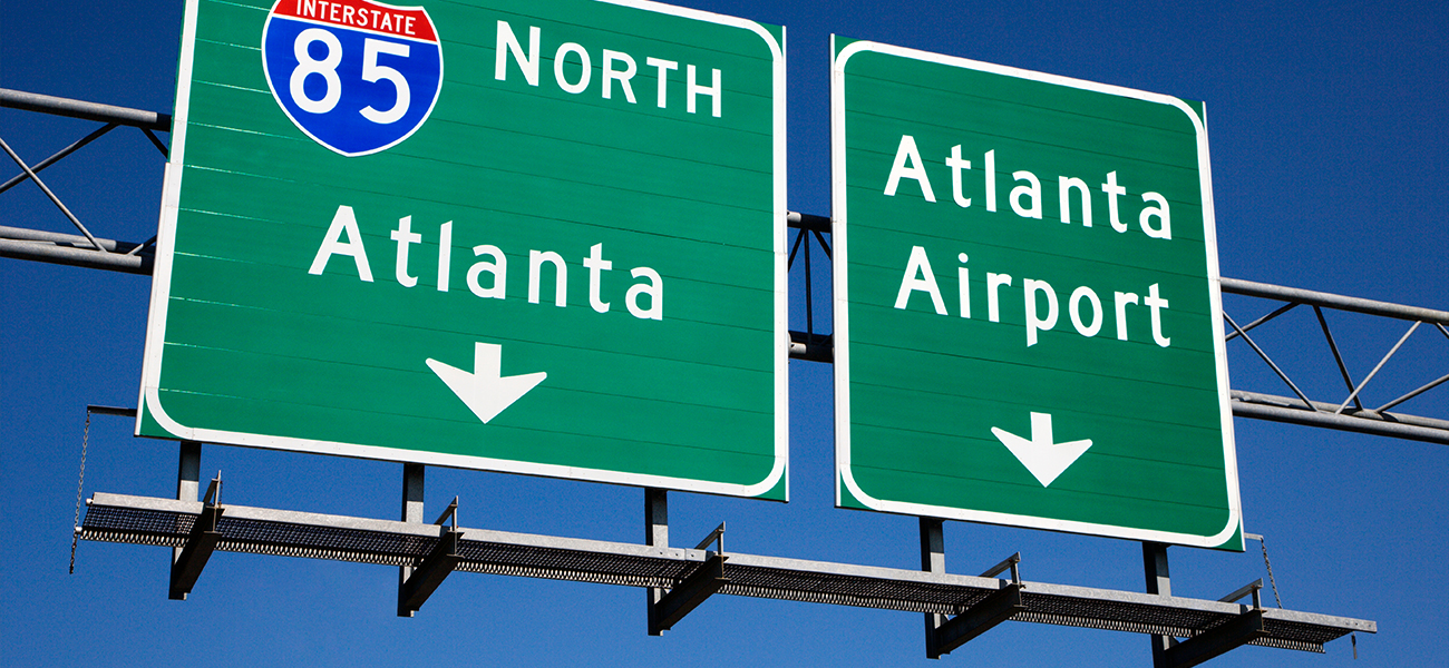 Highway signs to the Atlanta Airport and greater Atlanta area.
