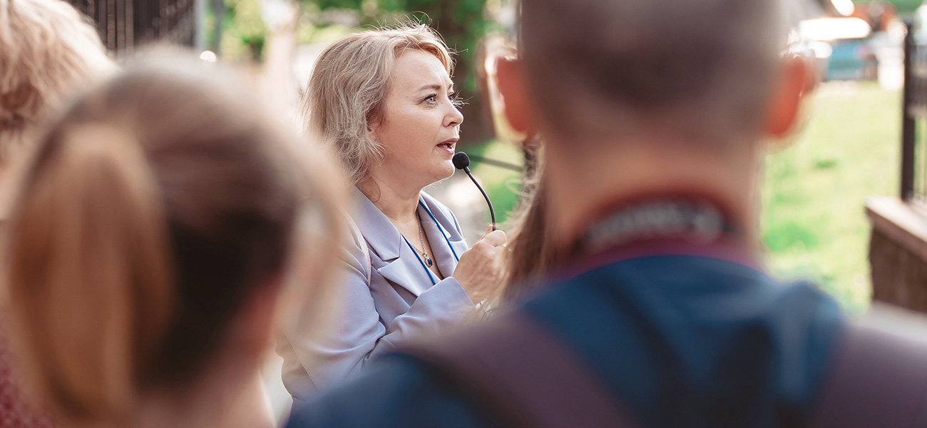Tour guide with attentive tourists.